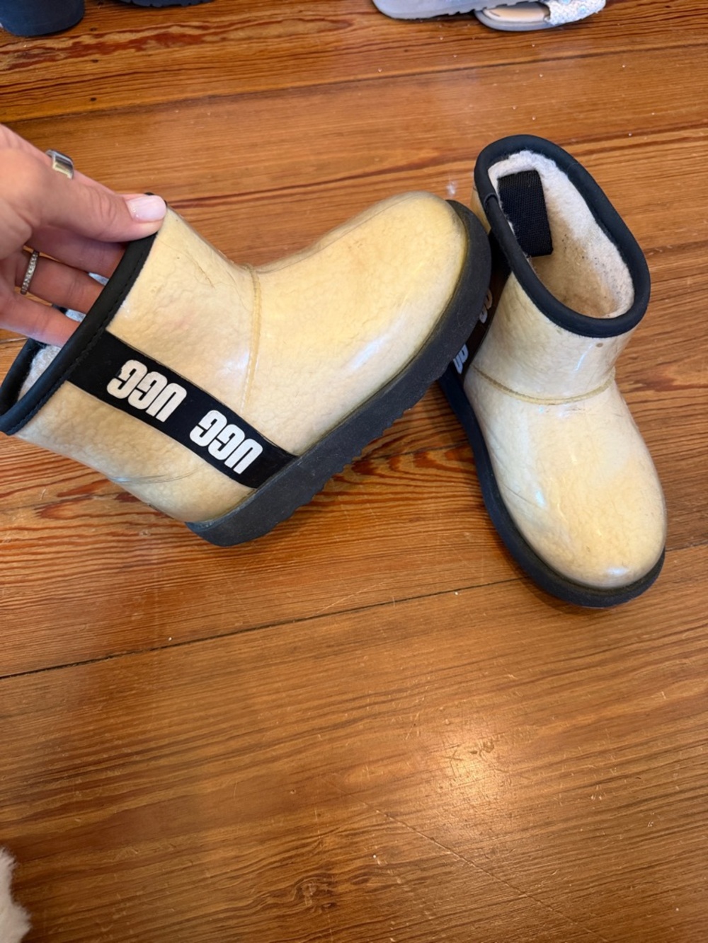 UGG Kids Cream Short Boot with Black Trim and Logo Strap